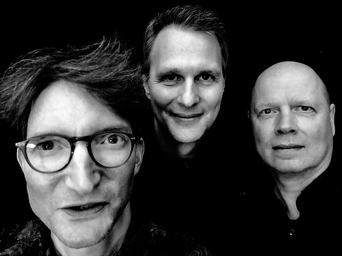 drei männl. Gesichter schwarz Weiß